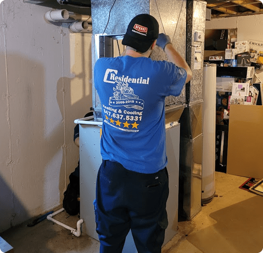 Residential technician working on a Schaumburg furnace